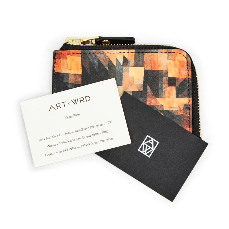 ART WRD artist and writer information cards on top of a cool unique wallet purse printed with Paul Klee art.