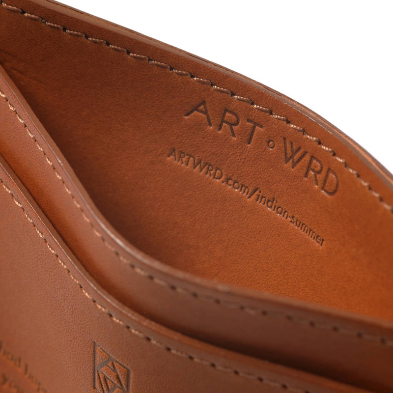 Ethical card holder made with non-toxic vegetable tanned leather inside view, displaying en embossed exploration web address.