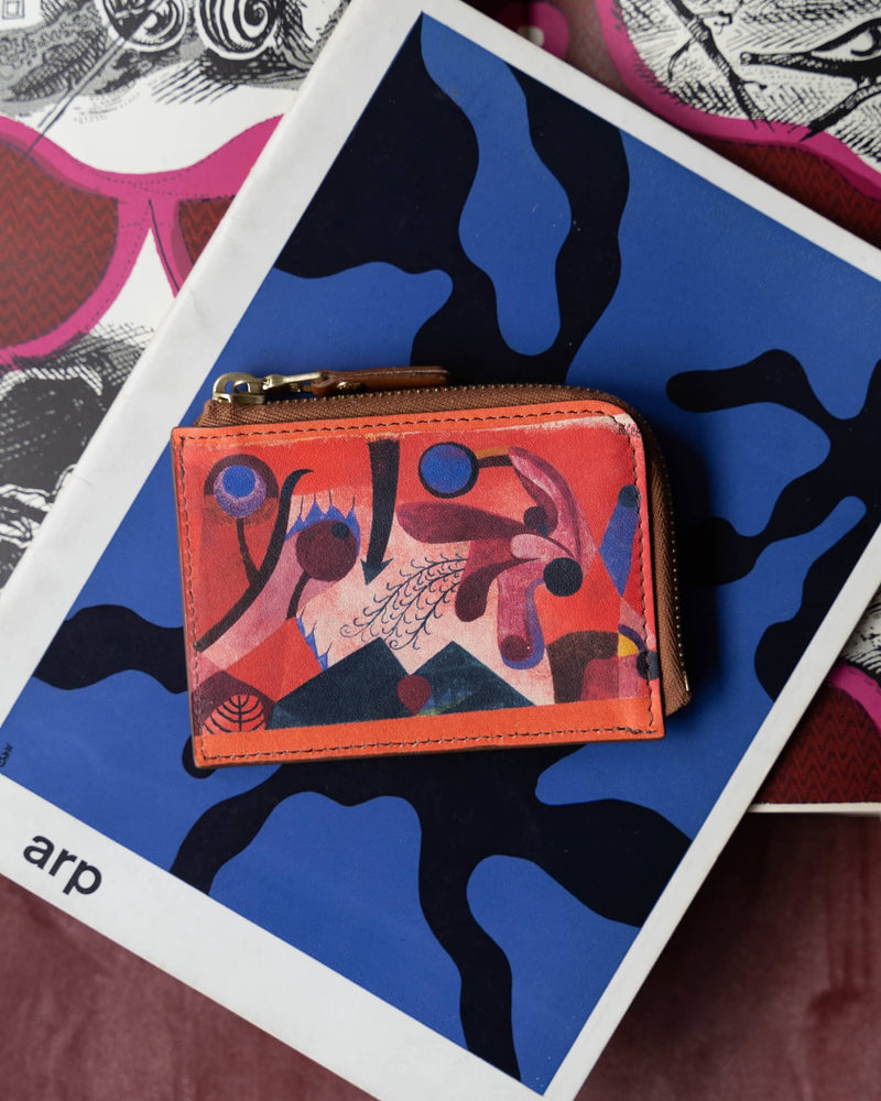 Striking lifestyle collage of a unique purse with Paul Klee art print.