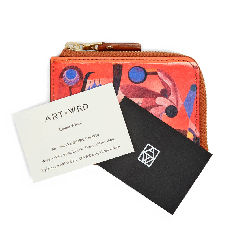 Unique purse with Paul Klee art print behind artist and writer information cards.