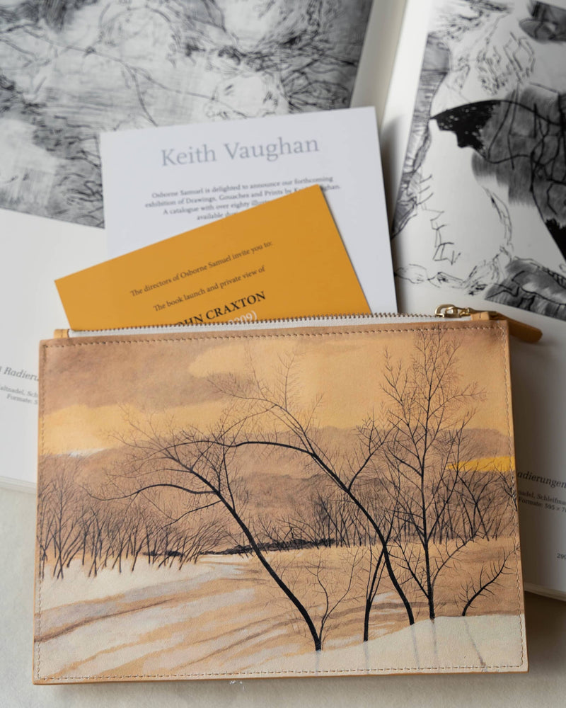 Art bag printed with a tree painting by Léon Spilliaert on art books with art exhibition leaflets coming out of it.