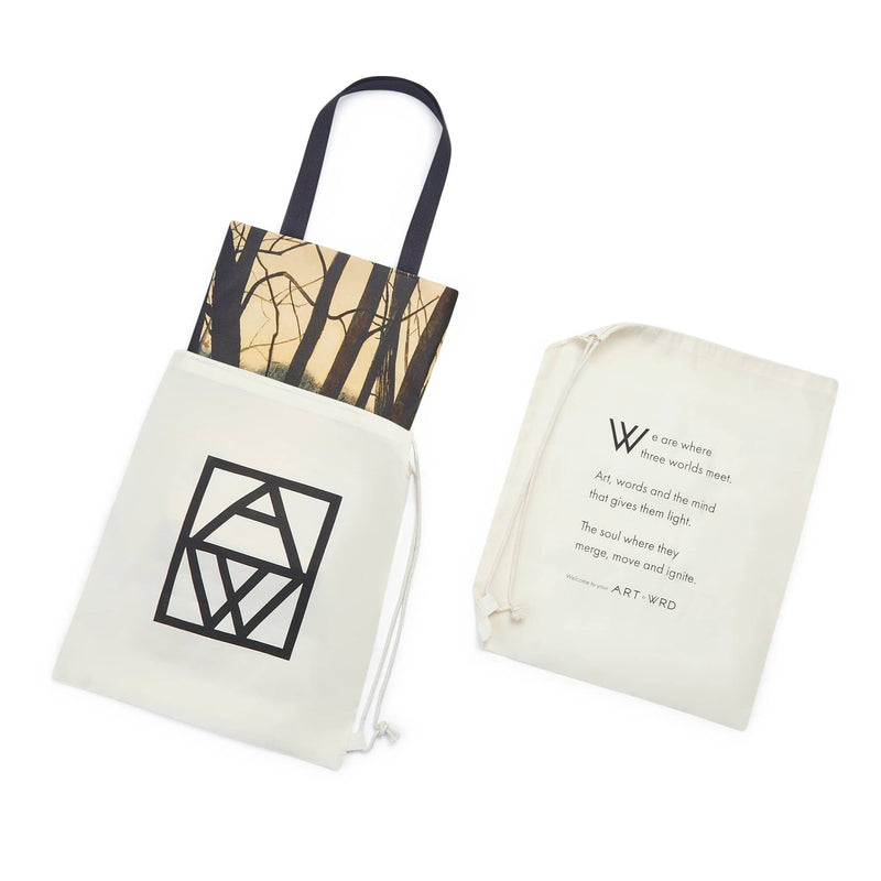 Artsy tote bag showing winter tree scene painting by Leon Spilliaert, shown in its dust bag packaging.  Tote bag packaging shows ART WRD logo on one side and the ART WRD Welcome Poem on the other side.
