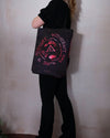 Bright pink tie-dye bag with Aubrey Beardsley witches design. 