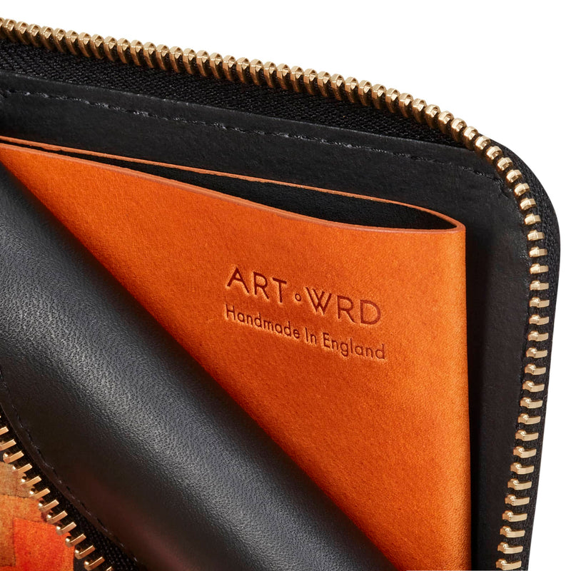 Inside view of a cool unique wallet purse shows a brown Italian vegetable tanned leather coin pocket. It's embossed with the ART WRD 'Handmade In England' logo.