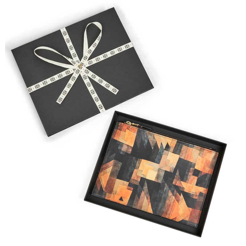 Leather art pouch printed with Paul Klee art in black box packaging tied with ART WRD logo cotton ribbon.