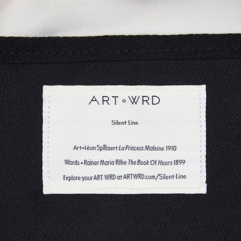 Unique art tote bag information label close up. The label gives details of the artist and writer that make up this bag.