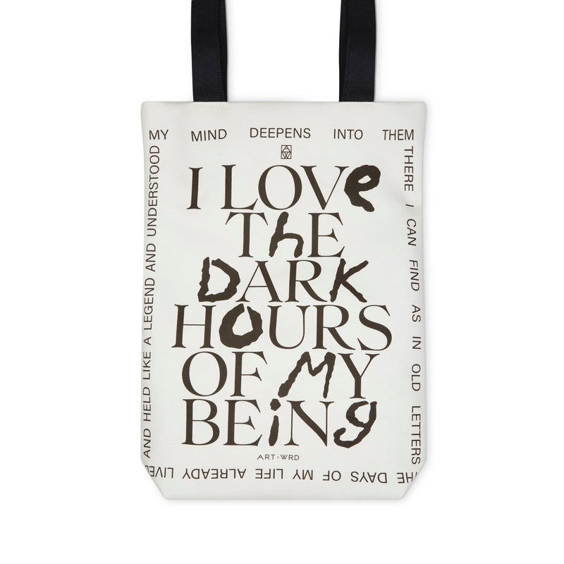 Reverse of a unique art tote bag displaying a Rainer Maria Rilke quote