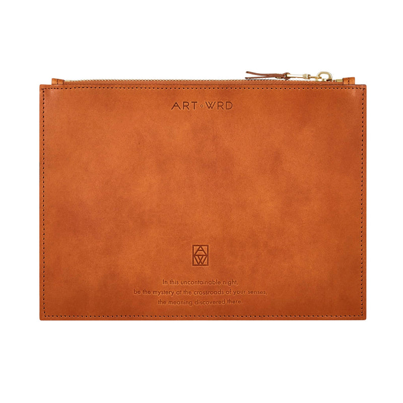 Reverse of unique bag with surrealist fish art by Paul Klee. A quote by Rainer Maria Rilke is embossed on brown Italian vegetable tanned leather.