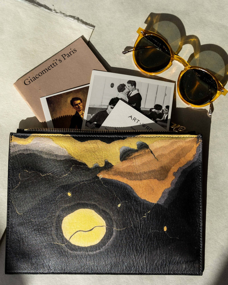 Unusual bag printed with Arthur Dove 'Me and The Moon' artwork with photos, art guides and arty yellow sunglasses coming out.