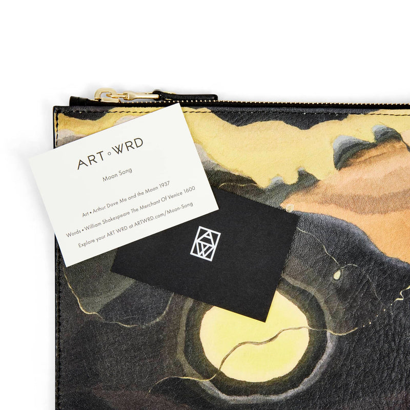 Artist and writer information card on top of an unusual bag printed with Arthur Dove 'Me and The Moon' artwork.